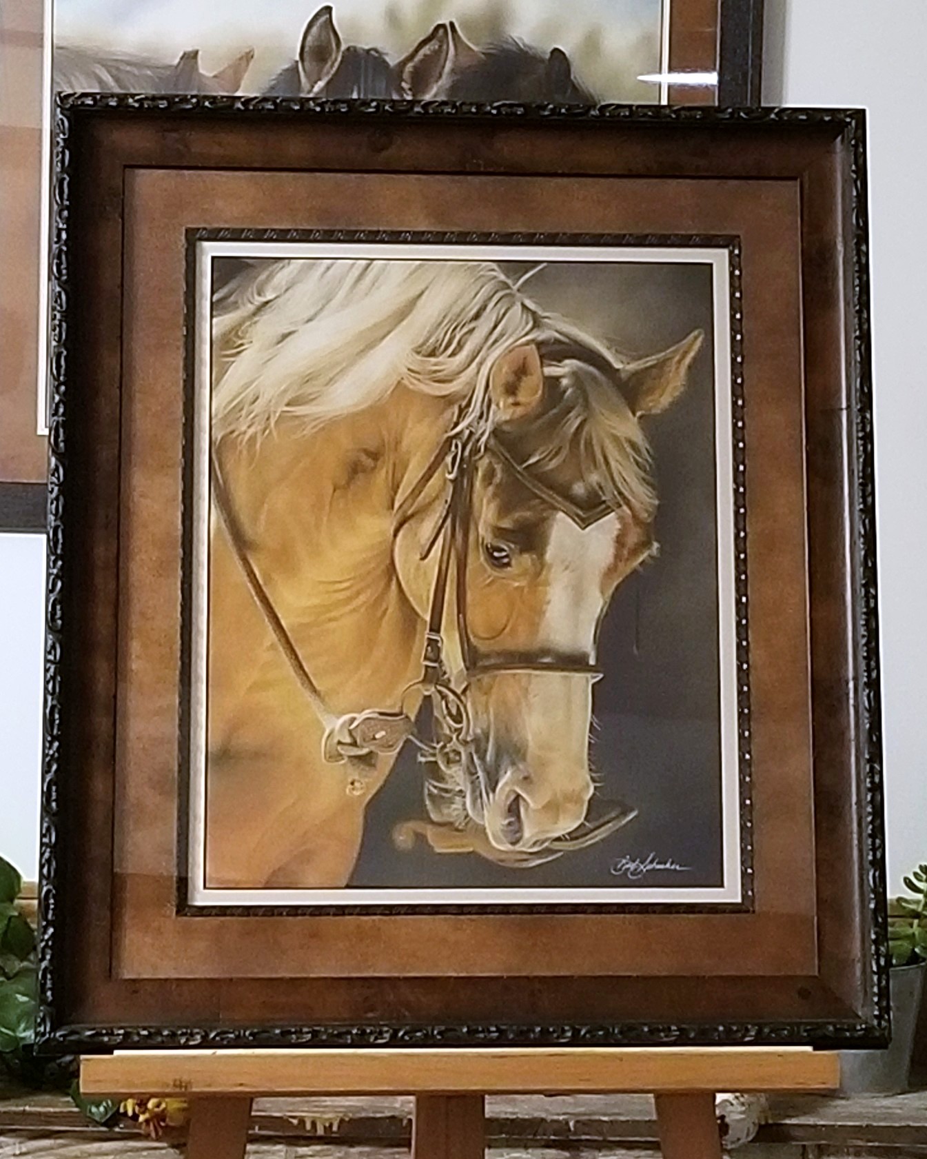 Award-winning pastel painting “Moment In The Spotlight” by Barb Schacher showing a Palomino horse under arena lighting